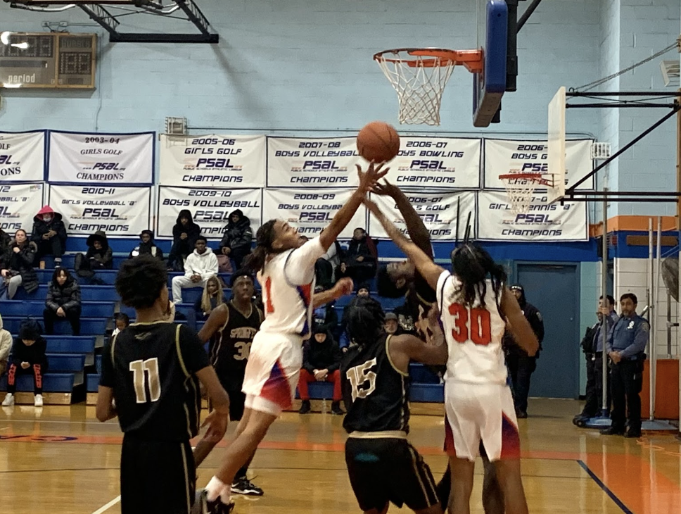 Boys Varsity Basketball Celebrates a Triumphant Victory Over Springfield Gardens