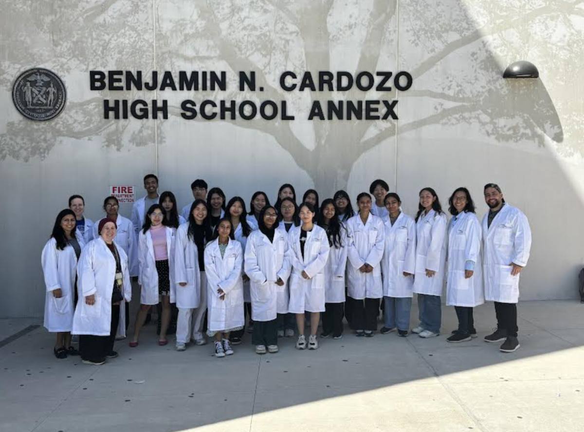 Students and Bio Med teachers pose in their white coats, celebrating their hard work and medical achievements in their program. Photo curtesy of Bio Med Program.