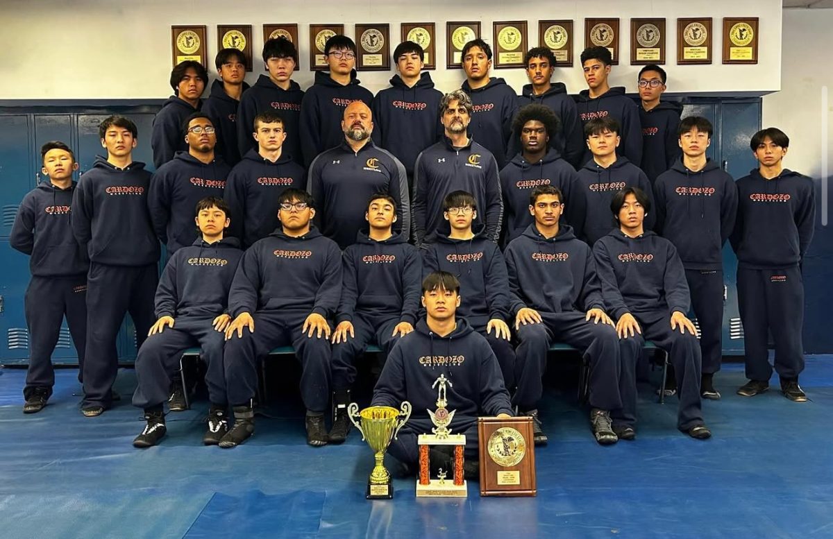The boys wrestling team at Cardozo has won the division championship for 15 years. Photo via Instagram @cardozowrestling.