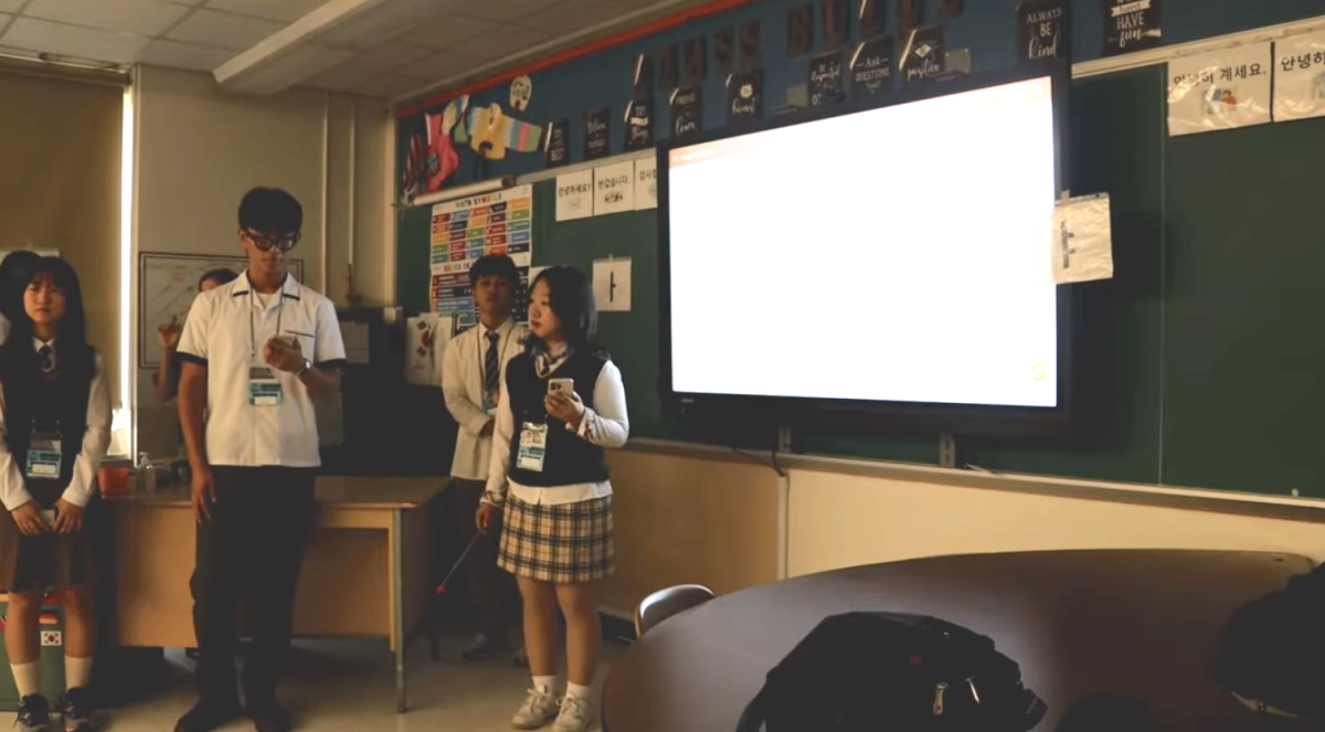 The South Korean exchange students presented to Korean foreign language classes during their visit. Photo by Veritas News reporters. 